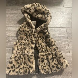 Fur vest with hoodie.